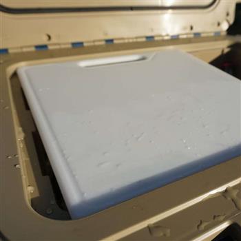 Cooler Cutting Board Divider sets on the inside rim of your cooler
